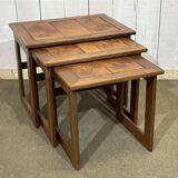 Set of 3 nesting tables in teak with tiled tops.