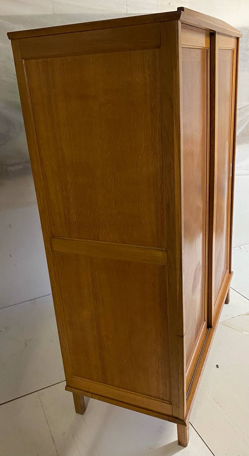 Vintage wardrobe with compass feet, sliding doors