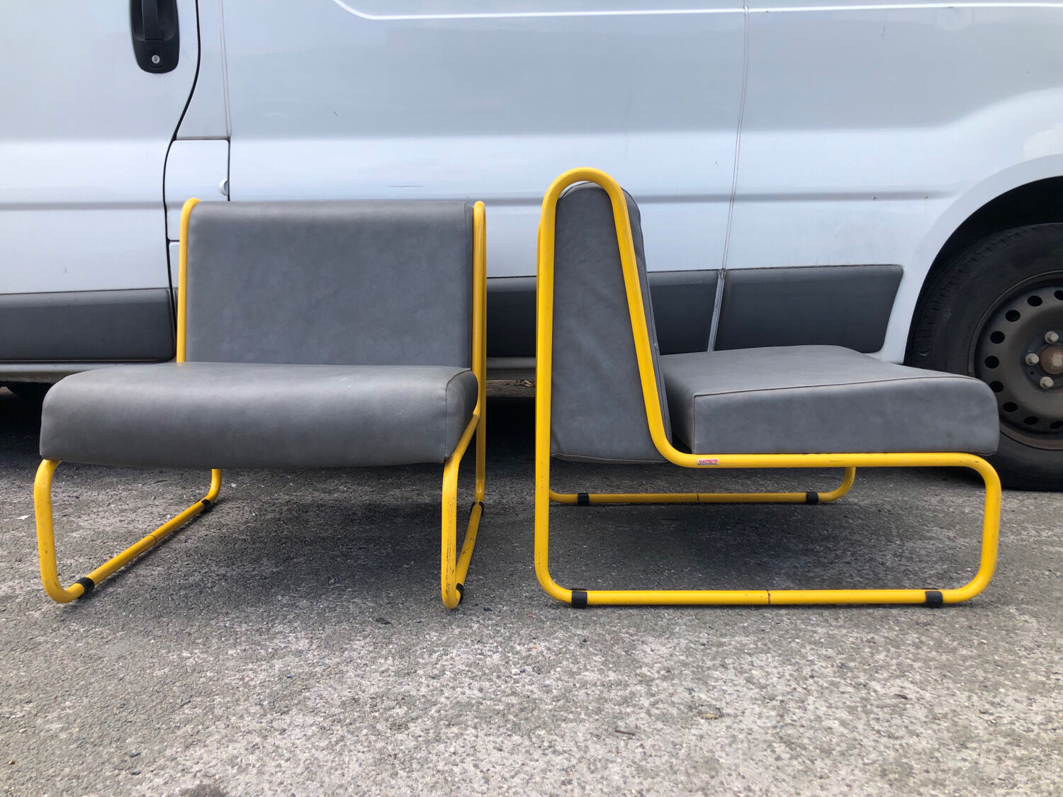 Pair of designer armchairs by Henri Julien