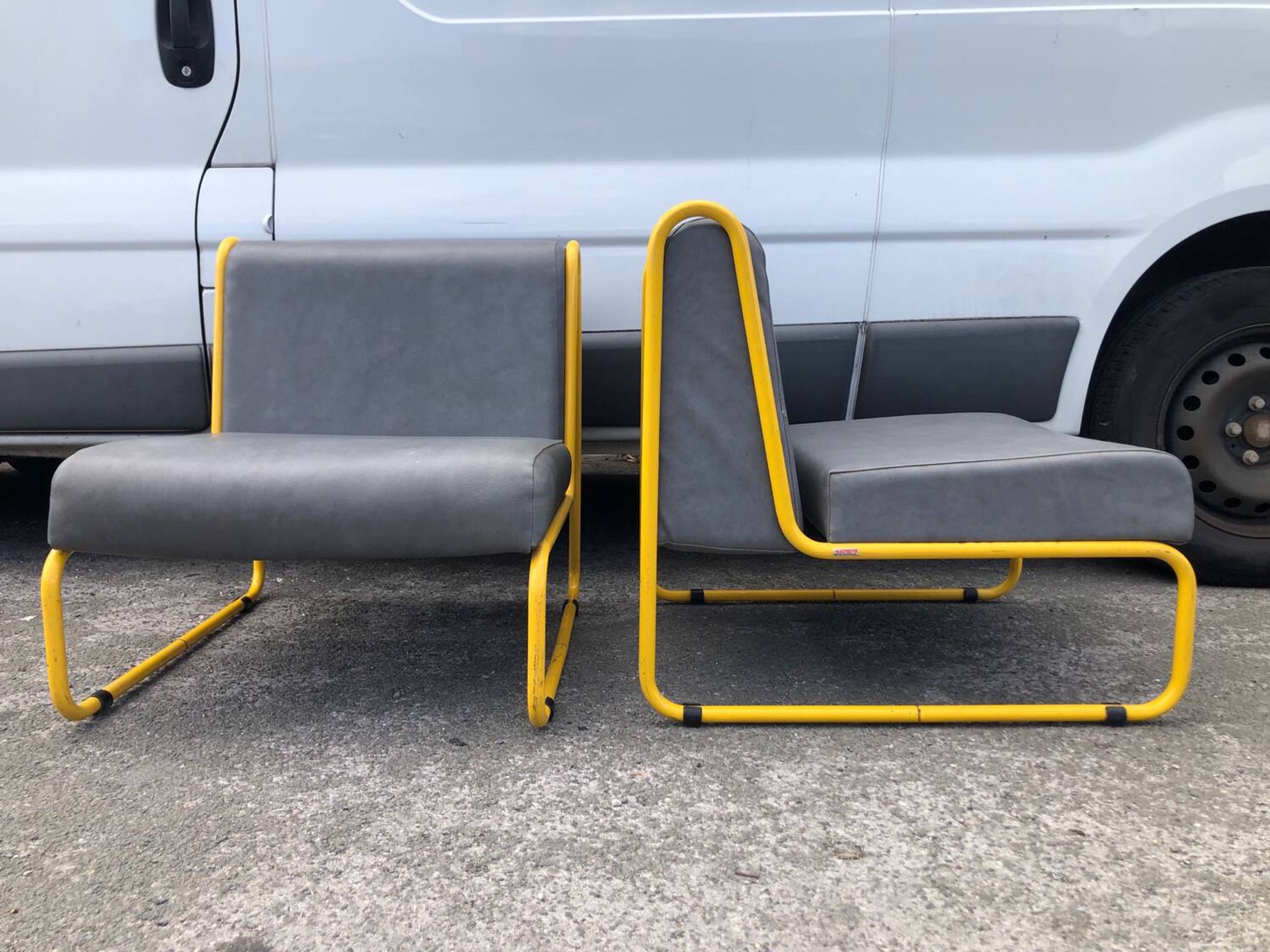 Pair of designer armchairs by Henri Julien