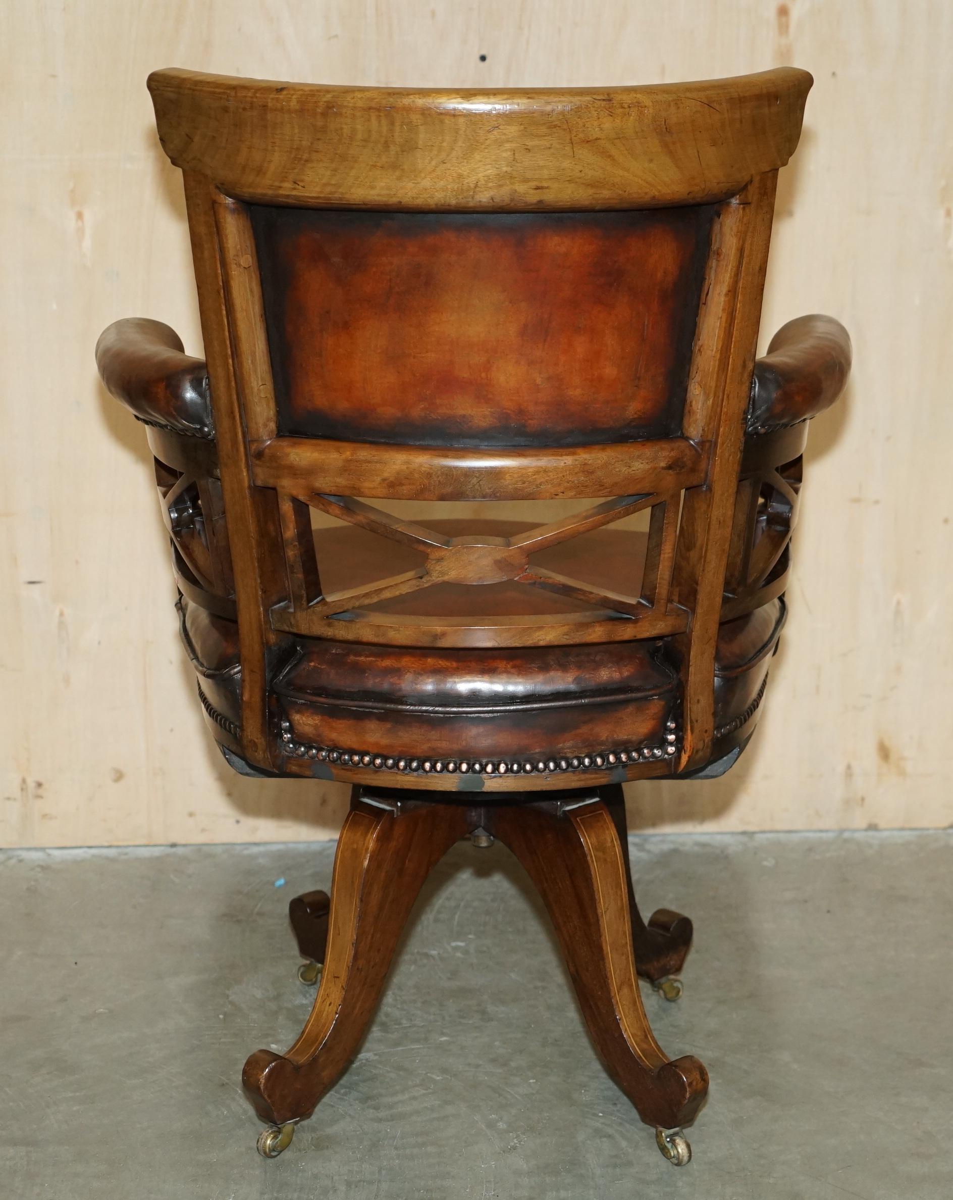 Victorian captain's chair in leather restored by Cornelius V Smith.