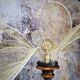 Table lamp, turned wooden foot, 8 rattan petals and golden mesh