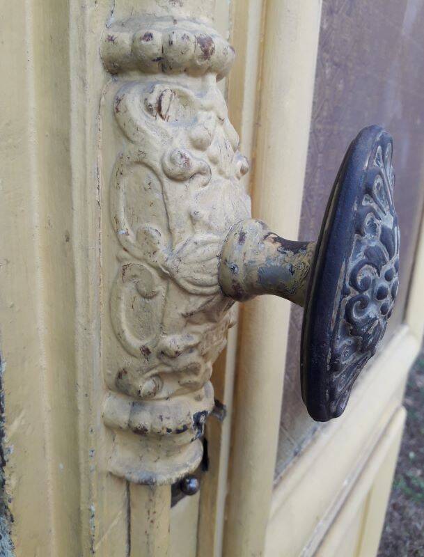 19th century double arched entrance door in oak with grilles and old glass