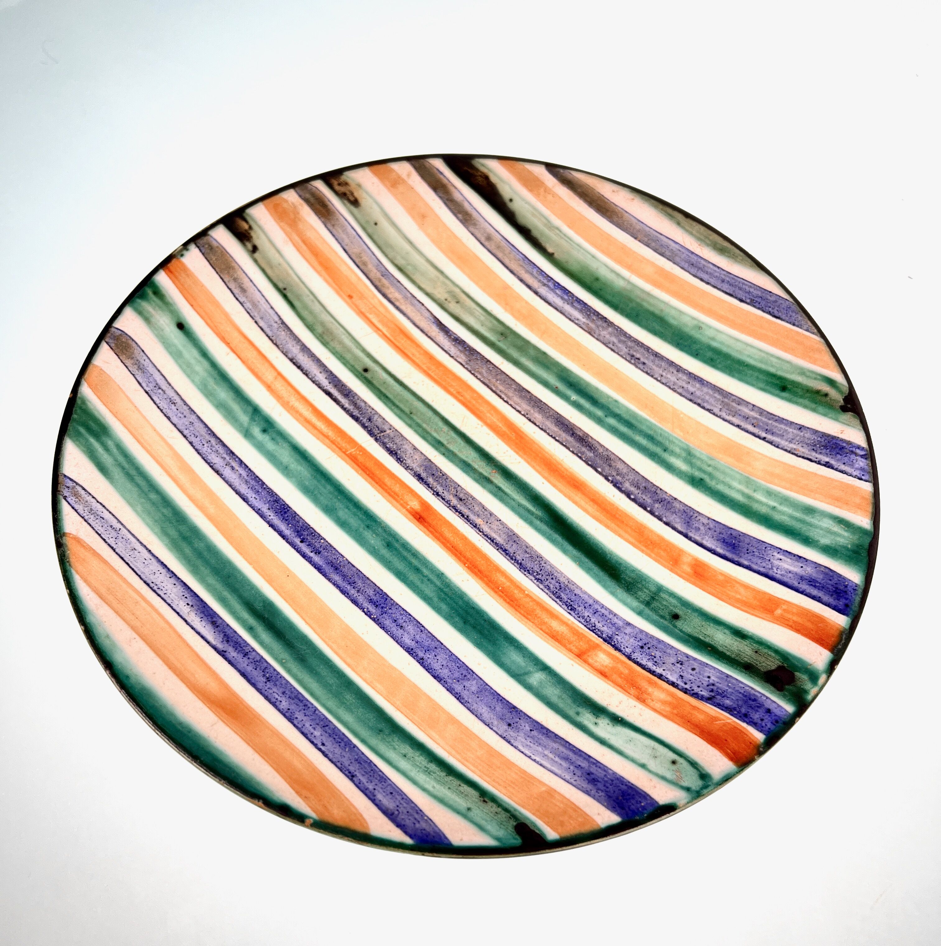 Flat ceramic plate by <Robert Picault