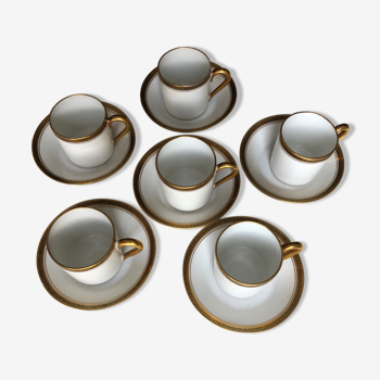 Set of six coffee cups with their sub-cups