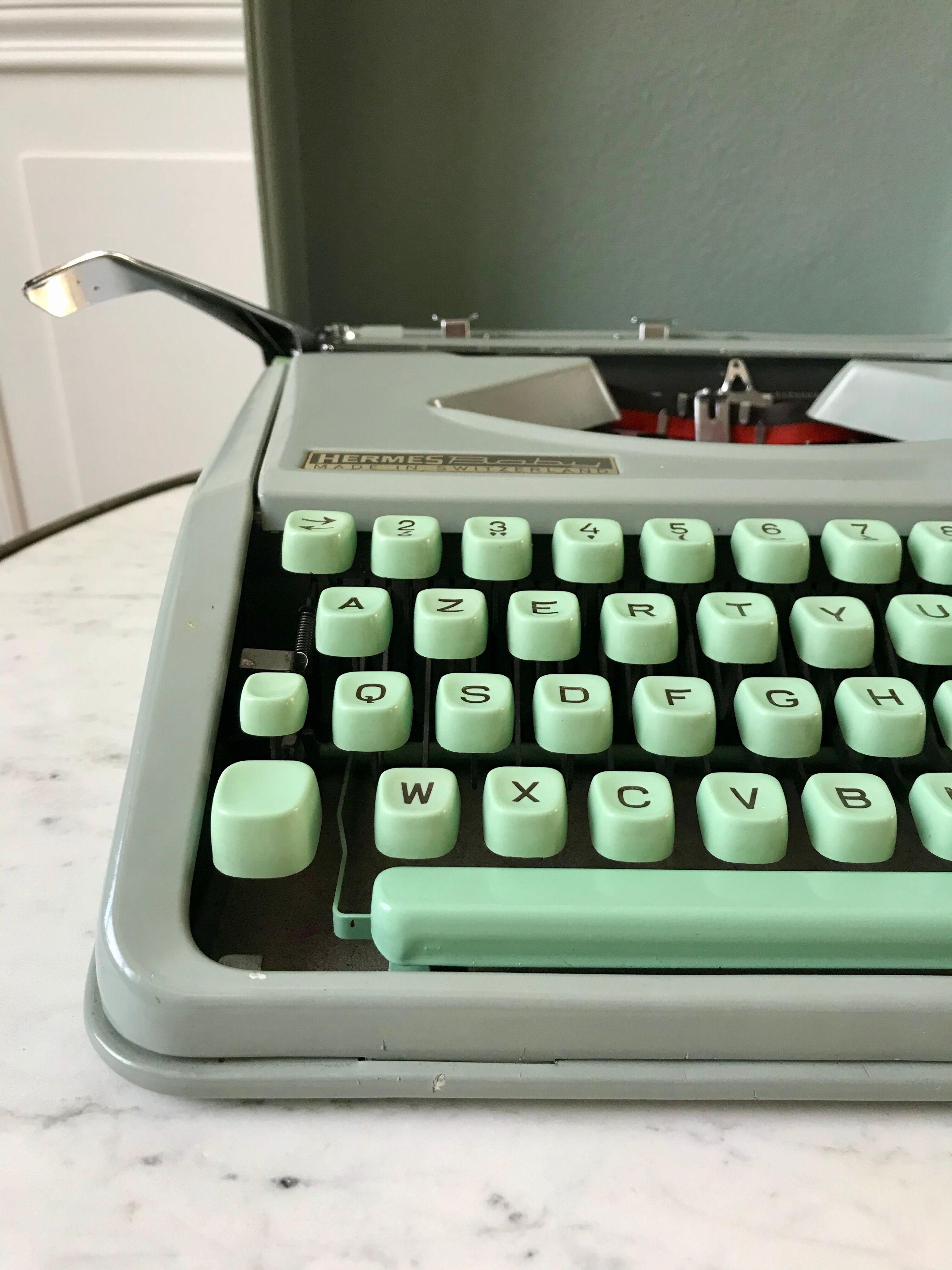 Mint green typewriter hermes baby made in switzerland