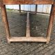 Old chestnut table with 3 front drawers and a cat bar.