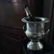 Silver metal champagne bucket.