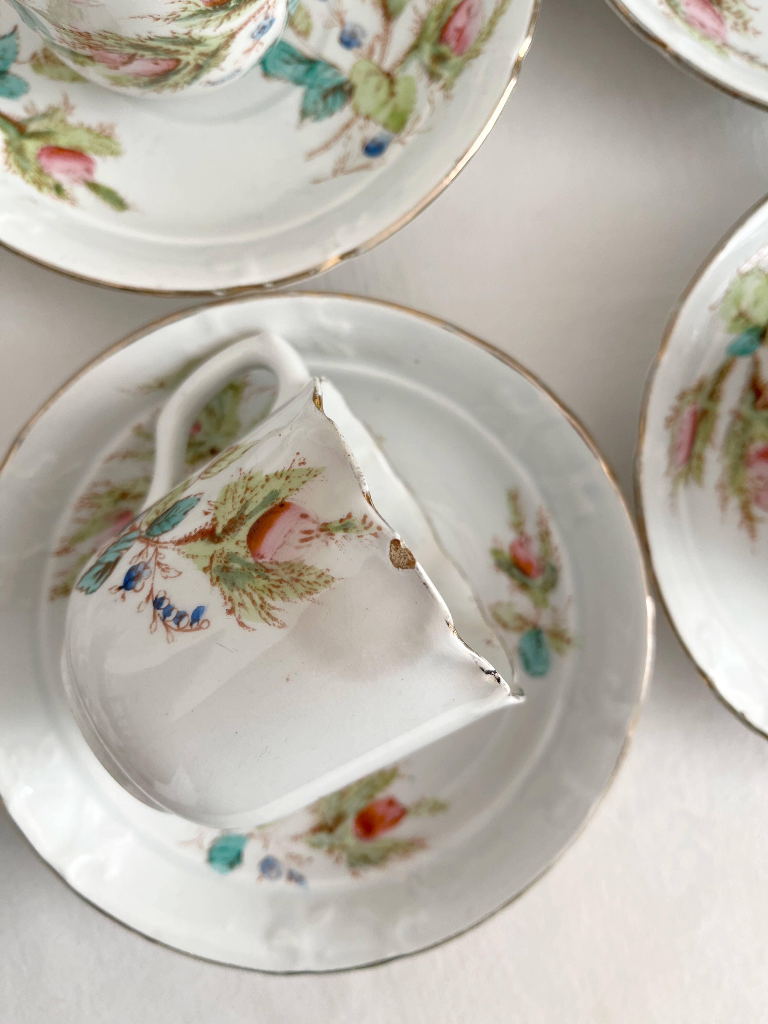 12 ironstone coffee cups with polychrome floral decoration, KG Lunéville