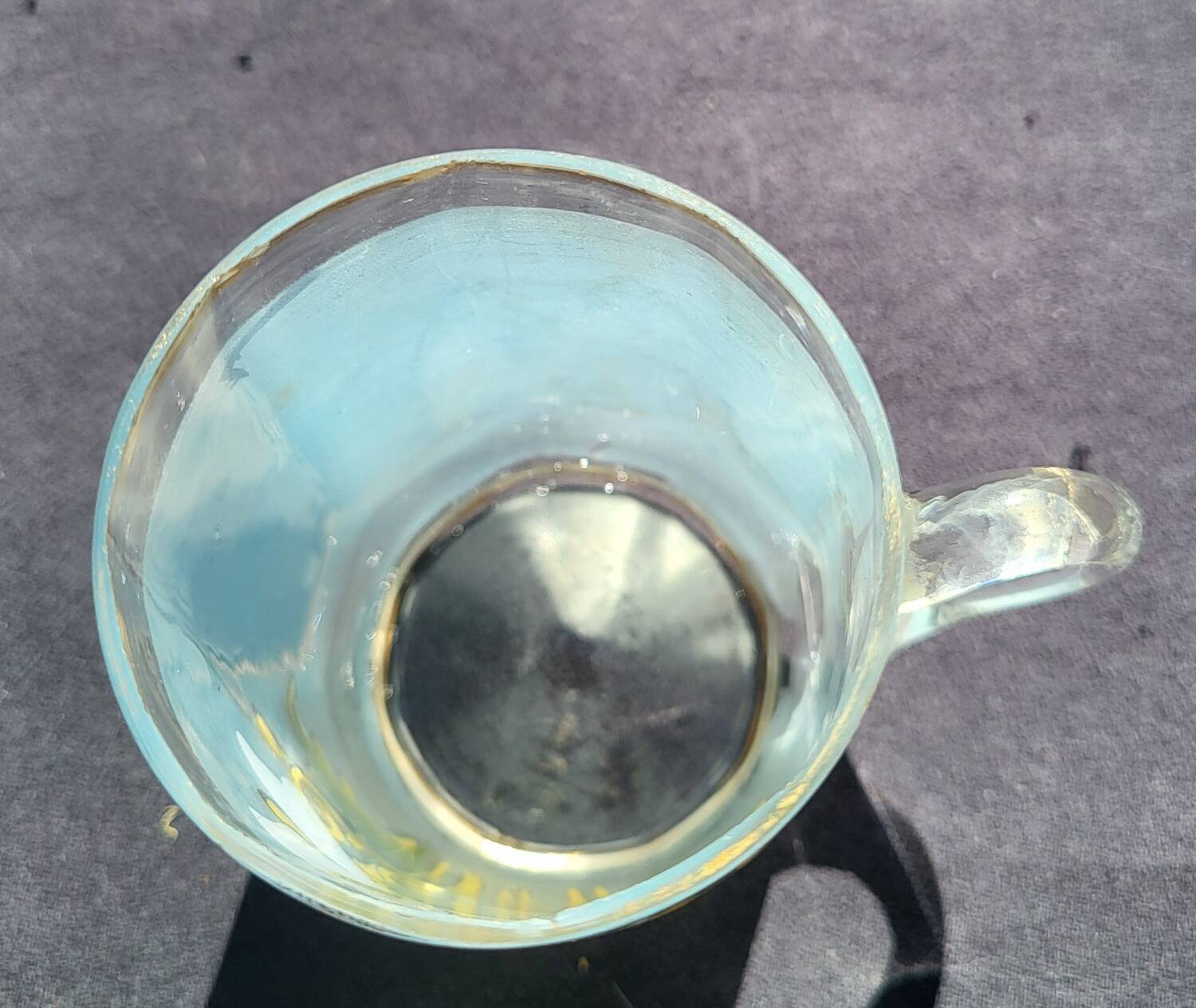 Old enameled blown glass cup