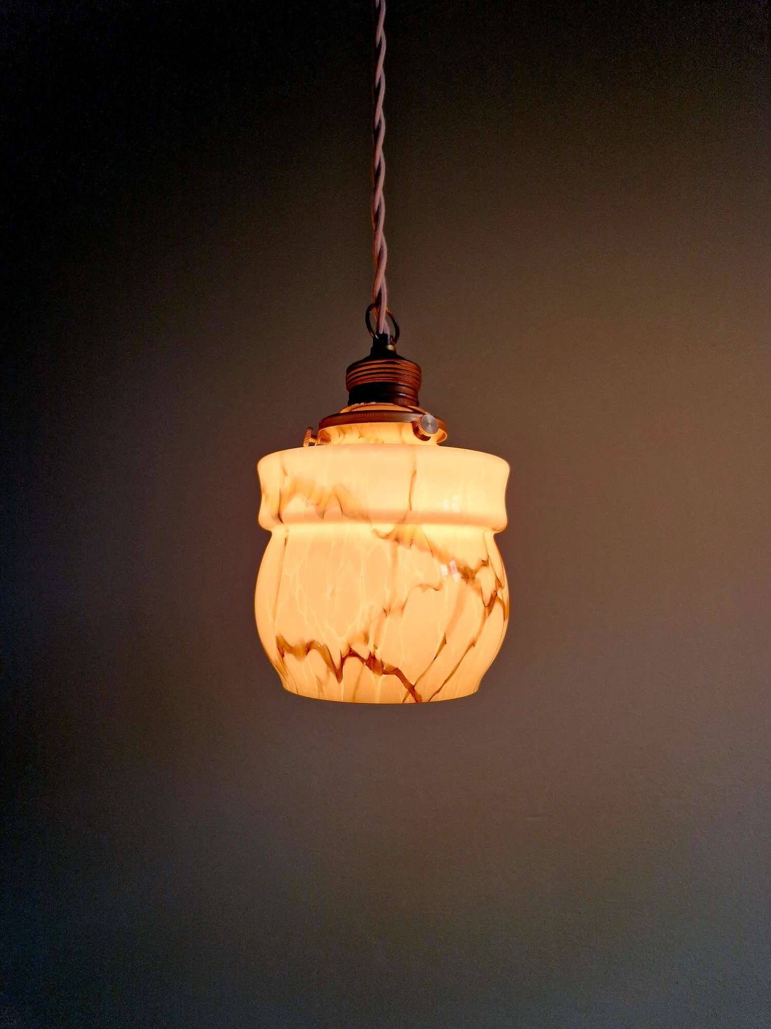 Art Deco trio of suspensions in opaline and marbled ouraline, Scailmont, 1920-30.