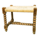 Straw footrest in turned wood