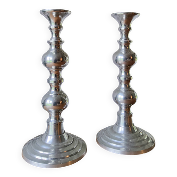 Pair of antique chrome metal candlesticks