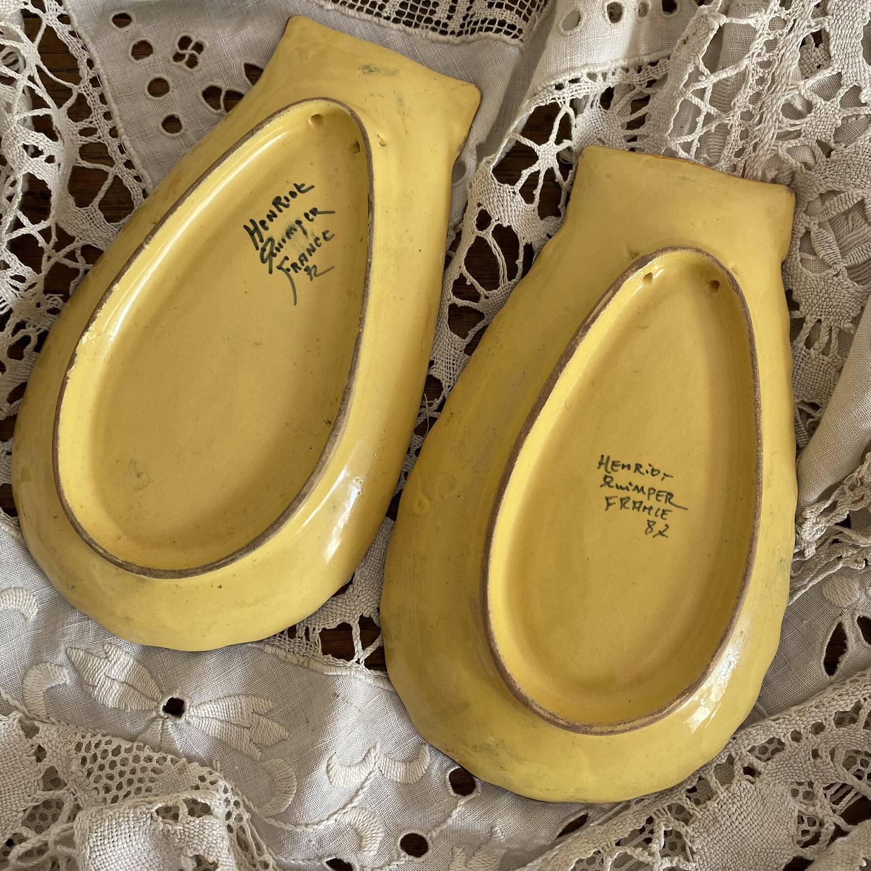 Shell-shaped butter dishes by Henriot Quimper for placing or hanging.