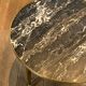 Round coffee table in brass with a marble top from the Ramsay house.