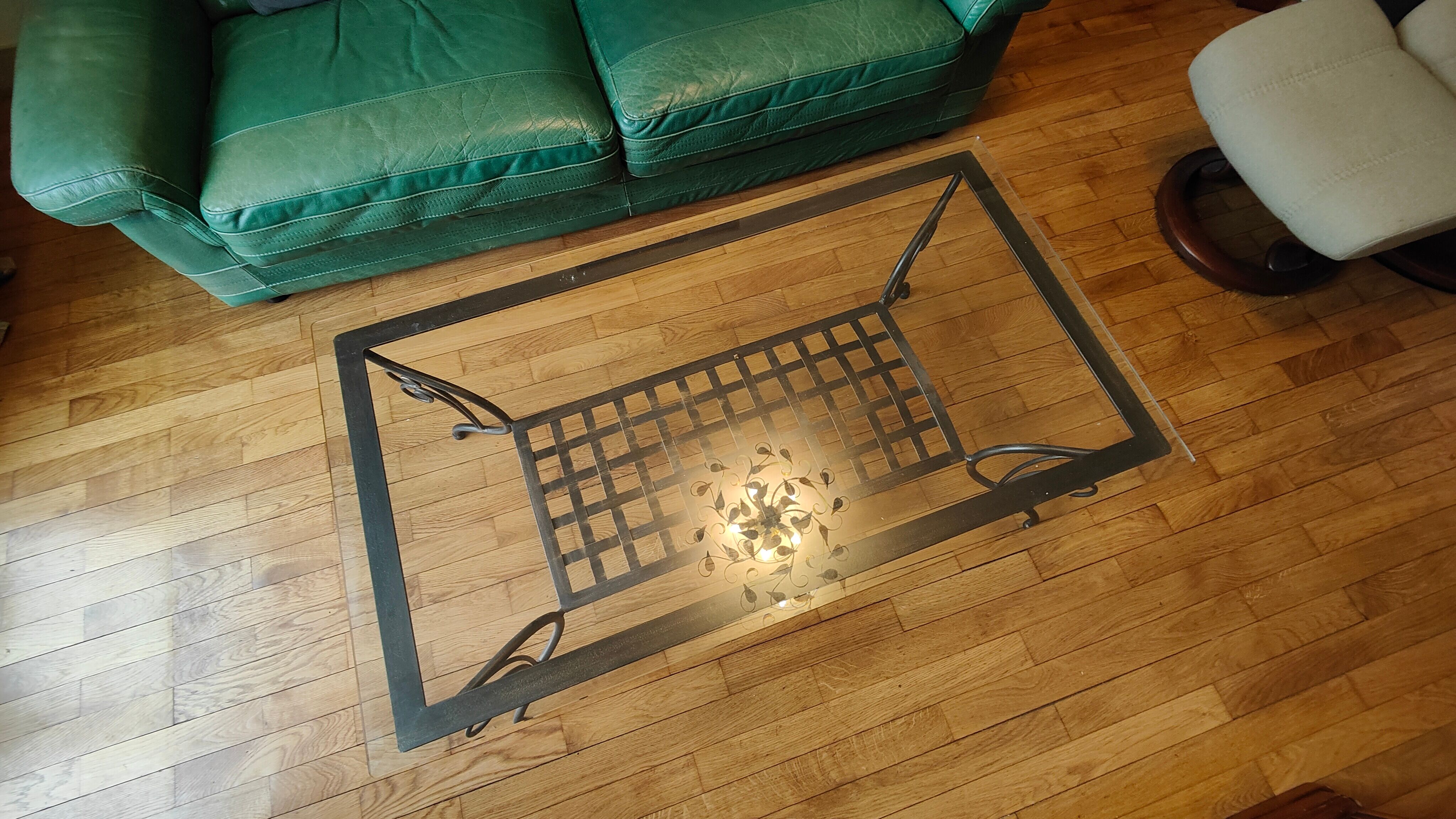 Black wrought iron coffee table and Roche Bobois glass top
