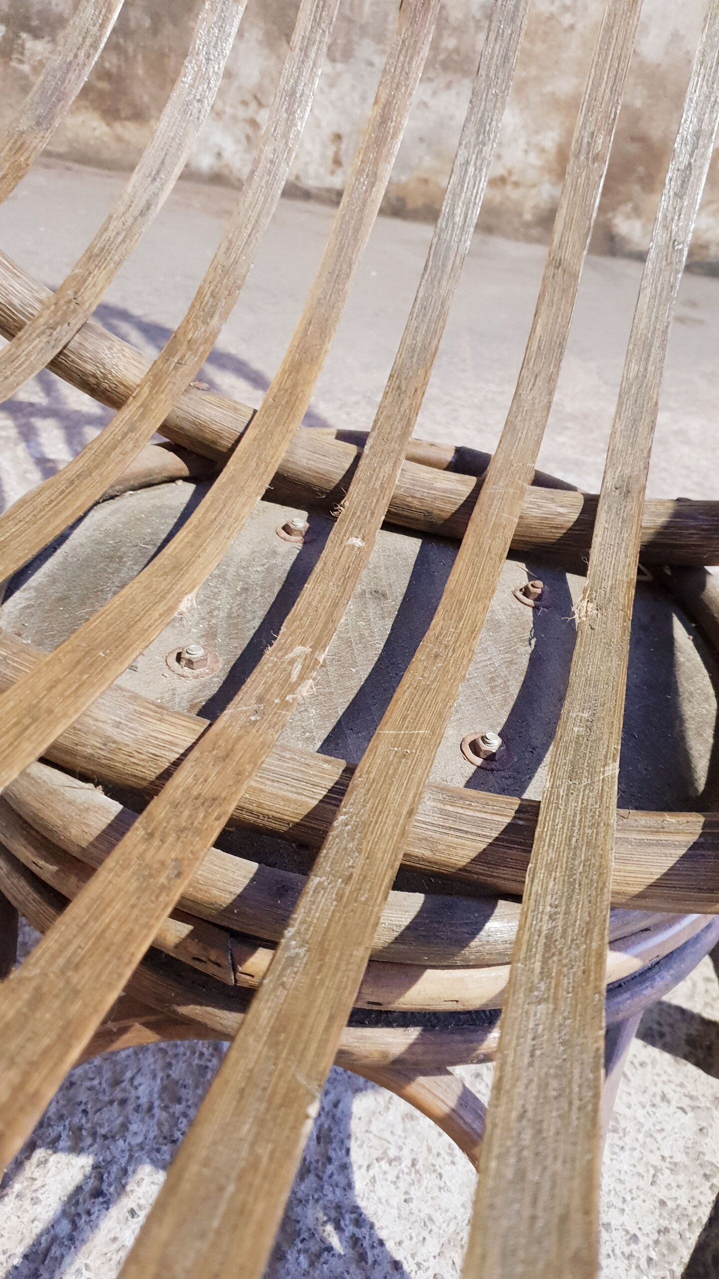 Antique swivel rattan armchair