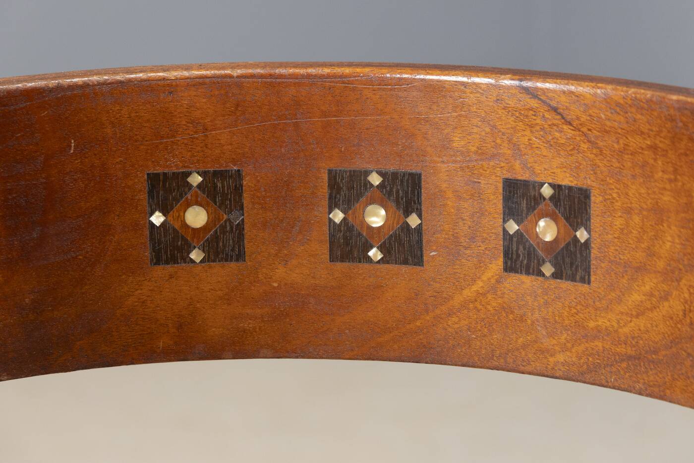 Central European armchair from the early 20th century with an inlaid backrest.