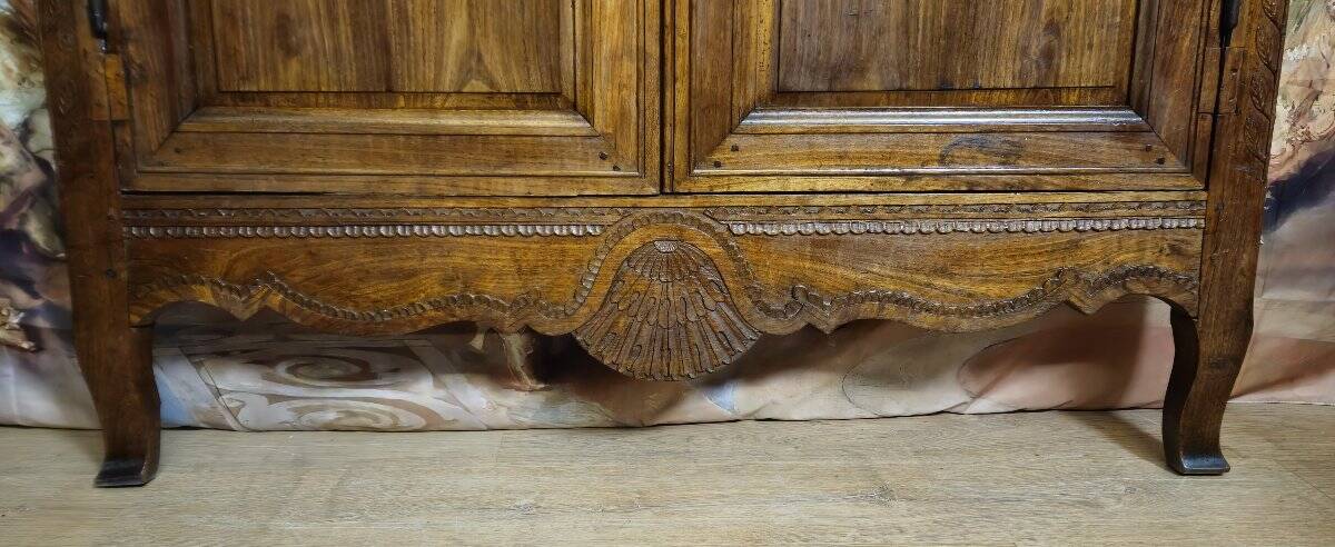 Louis XV period wardrobe façade, solid wood architectural elements, richly carved.