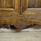 Louis XV period wardrobe façade, solid wood architectural elements, richly carved.
