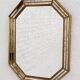Octagonal mirror in Venetian style with gold-rimmed parecloses
