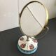 Double round mirror on porcelain foot 15x19cm