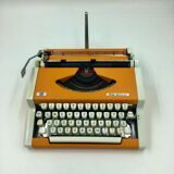 WE typewriter orange