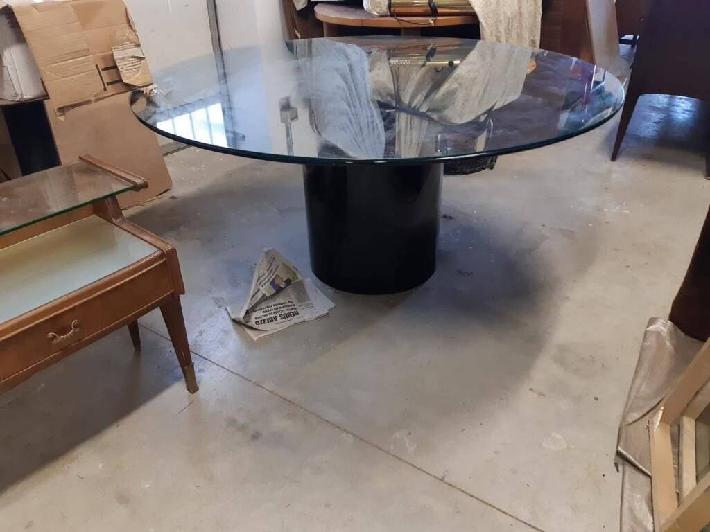 Black lacquered glass table and glass in the hoof style, Italy.