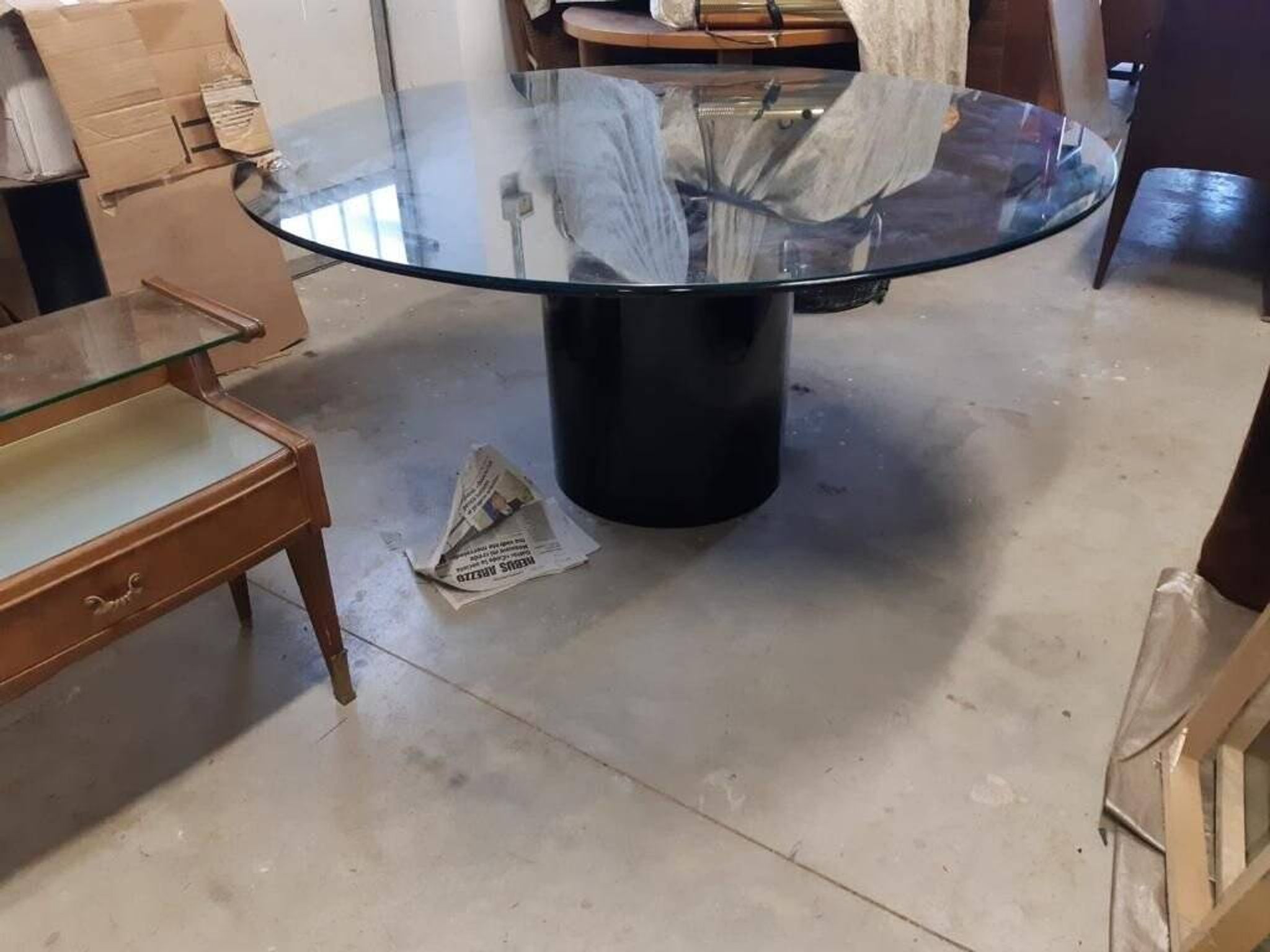 Black lacquered glass table and glass in the hoof style, Italy.