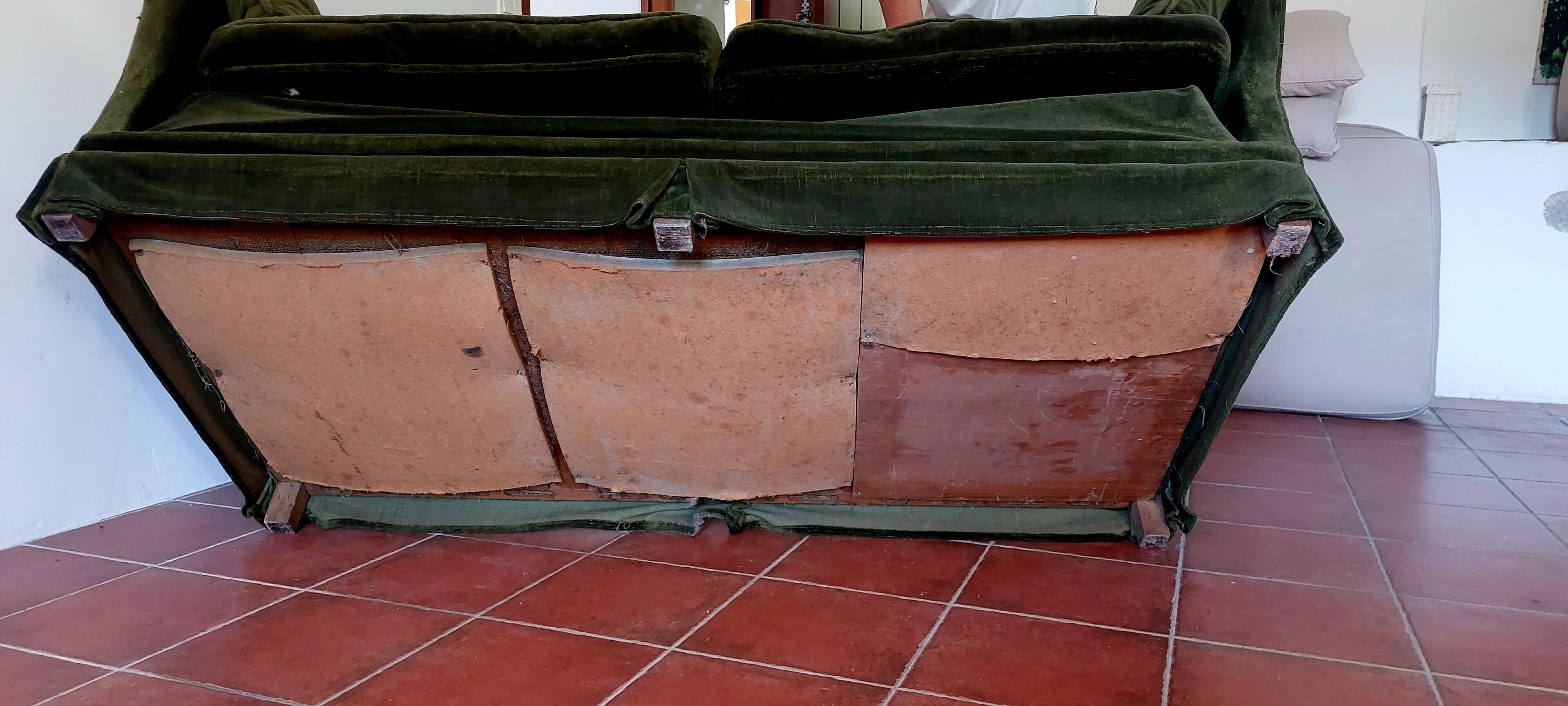 Antique green velvet sofa
