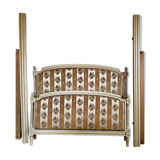 Louis XVI style bed in patinated wood with fluted columns.