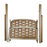 Louis XVI style bed in patinated wood with fluted columns.