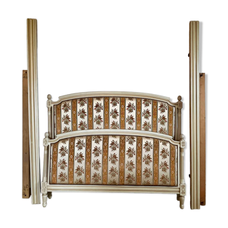 Louis XVI style bed in patinated wood with fluted columns.