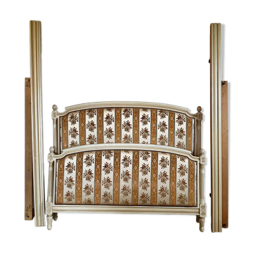 Louis XVI style bed in patinated wood with fluted columns.