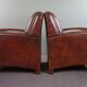 A very beautiful set of 2 Art Deco design armchairs in sheep leather