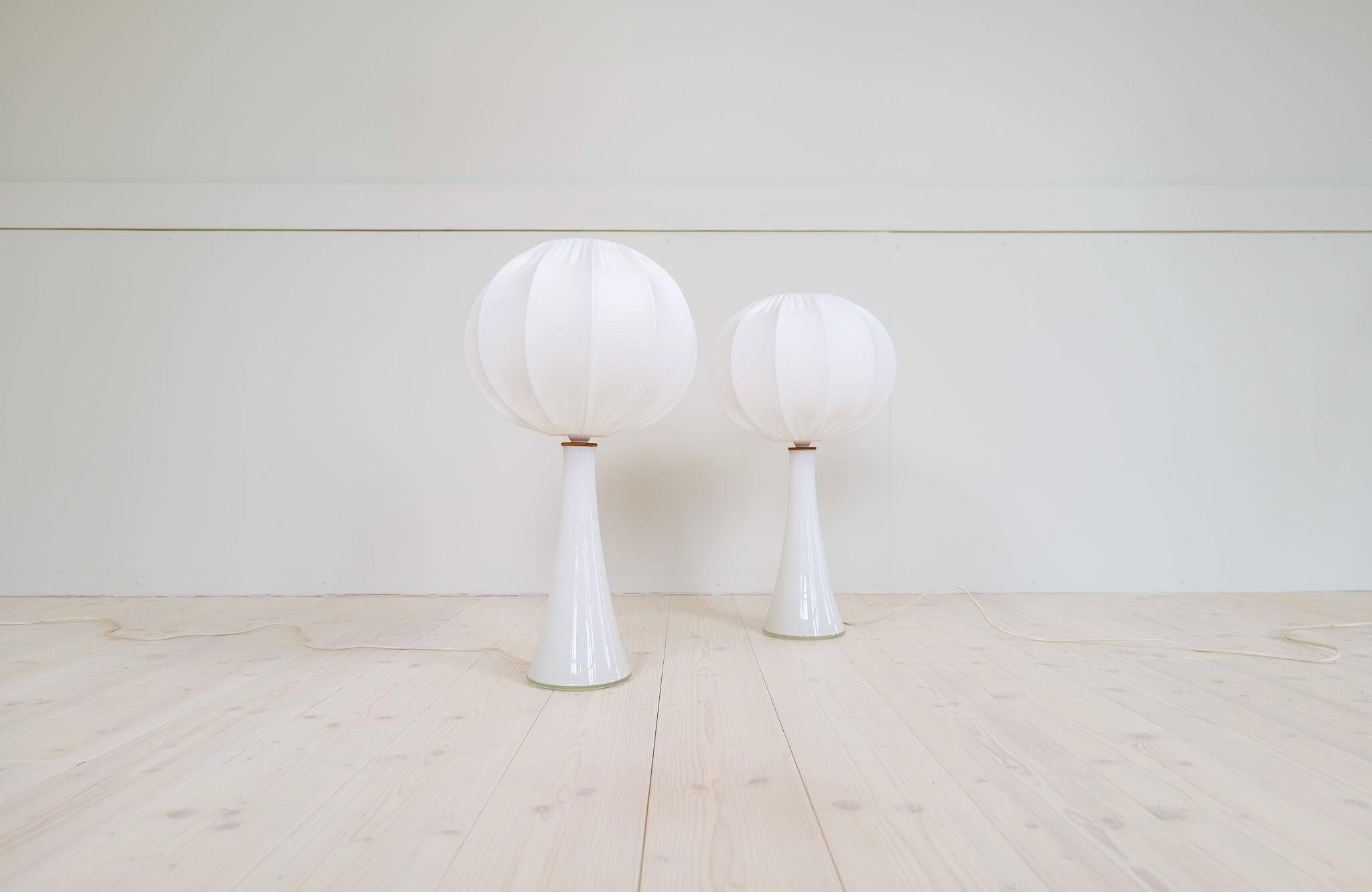 Pair of mid-century opaline glass table lamps with cotton shades by Bergboms, Sweden, 1960.
