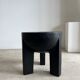 Black mango wood tripod side table with a semi-spherical top, height: 45 cm, diameter: 44 cm.