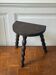 Three-legged turned wooden stool