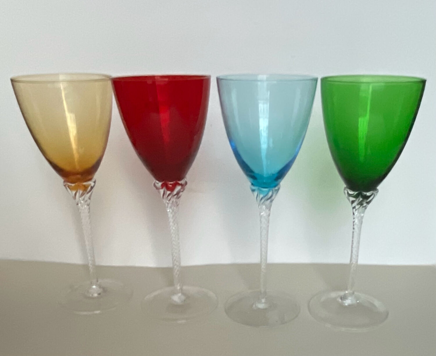 4 coloured stemmed glasses