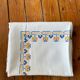 Embroidered white tablecloth
