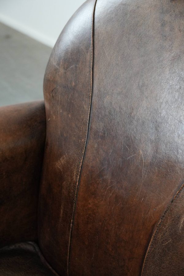 Beautiful vintage sheep leather armchair with a characterful appearance
