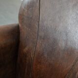 Beautiful vintage sheep leather armchair with a characterful appearance