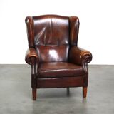 Luxurious sheepskin armchair with a fixed seat cushion and high seating comfort