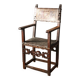 Antique armchair in walnut and studded leather, 17th century