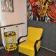 Art Deco armchair in yellow and black, made of painted wood and cotton, high back, 1920s.