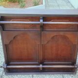 Bar counter in solid exotic teak wood; molded panel decor.
