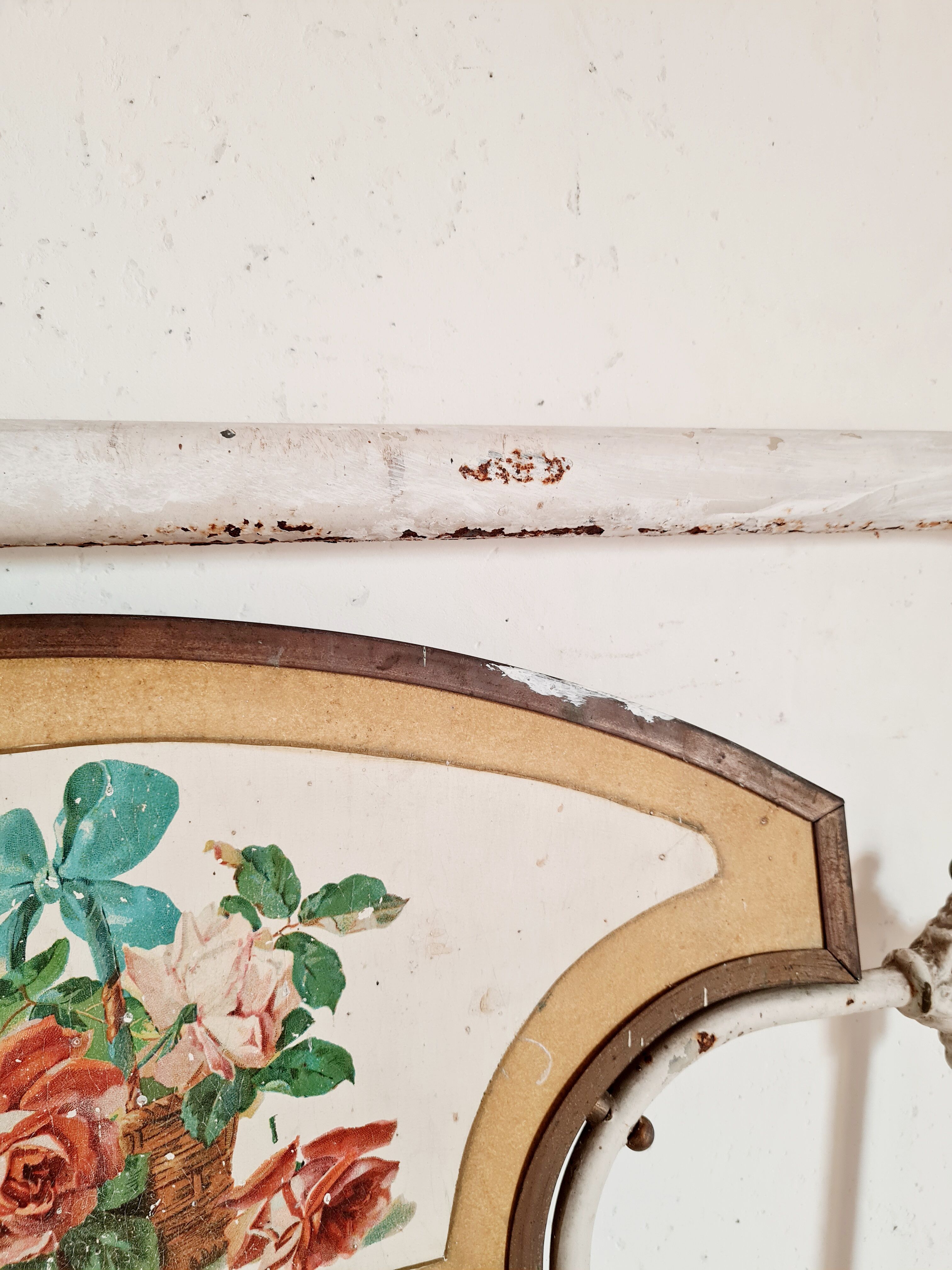 Cast-iron headboard and patinated white wood