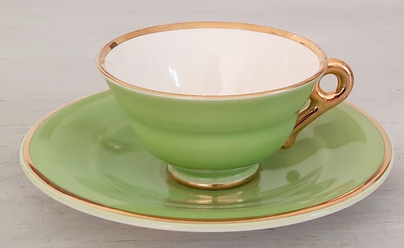 Coffee cup and under cup in green Salins earthenware and vintage gold net