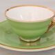 Coffee cup and under cup in green Salins earthenware and vintage gold net