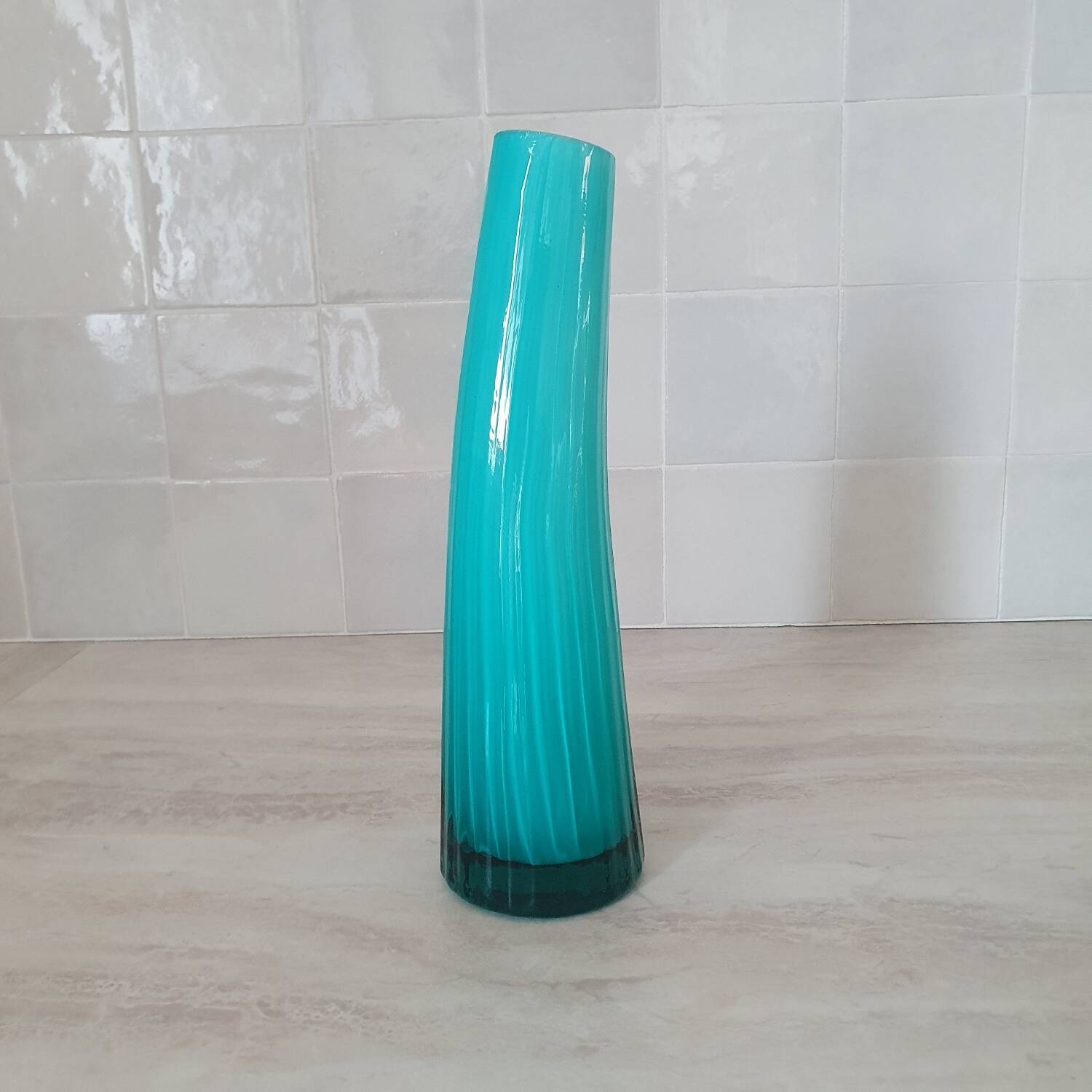 Curved turquoise blue blown glass soliflore vase